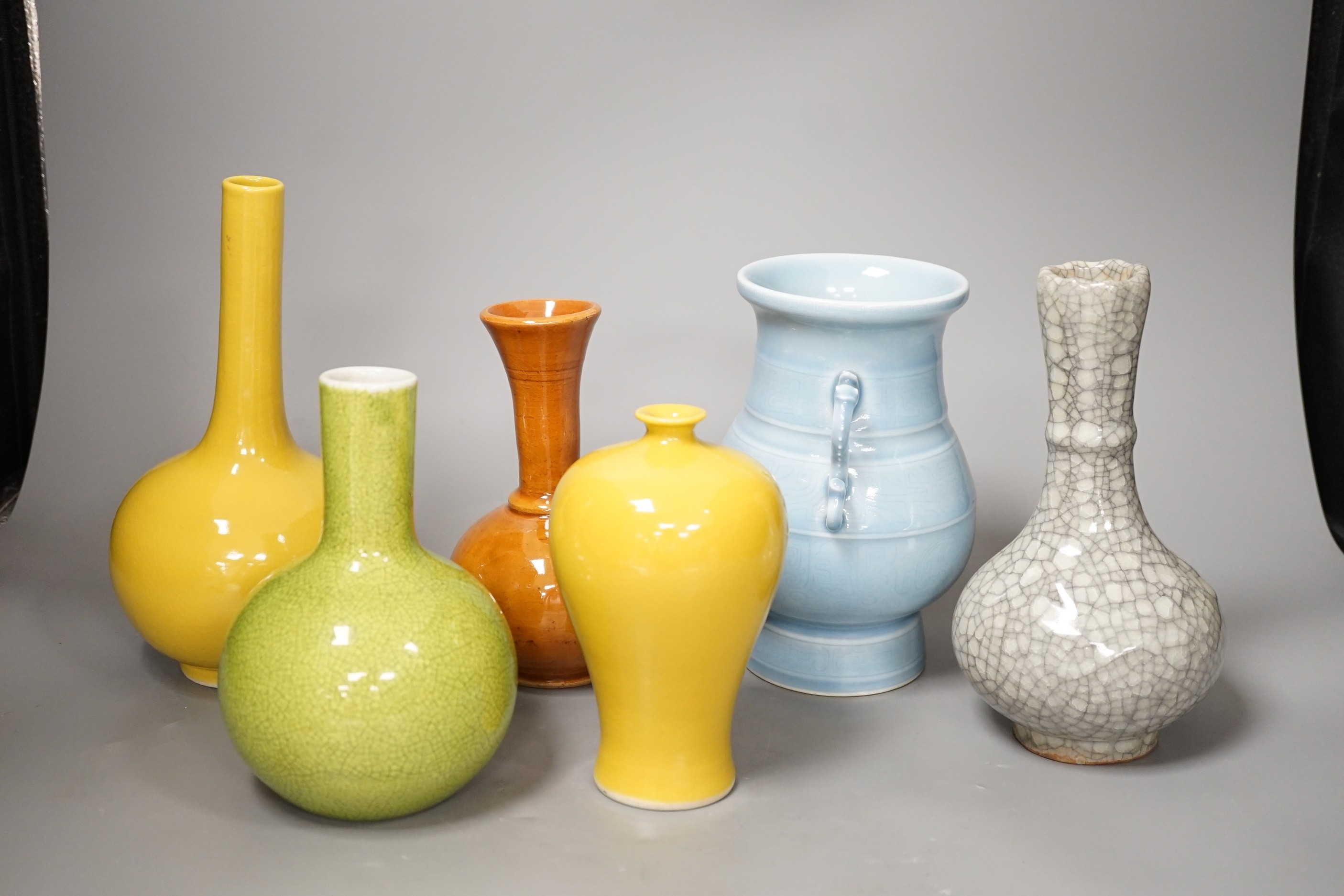 Six various Chinese porcelain or pottery vases, 22cm